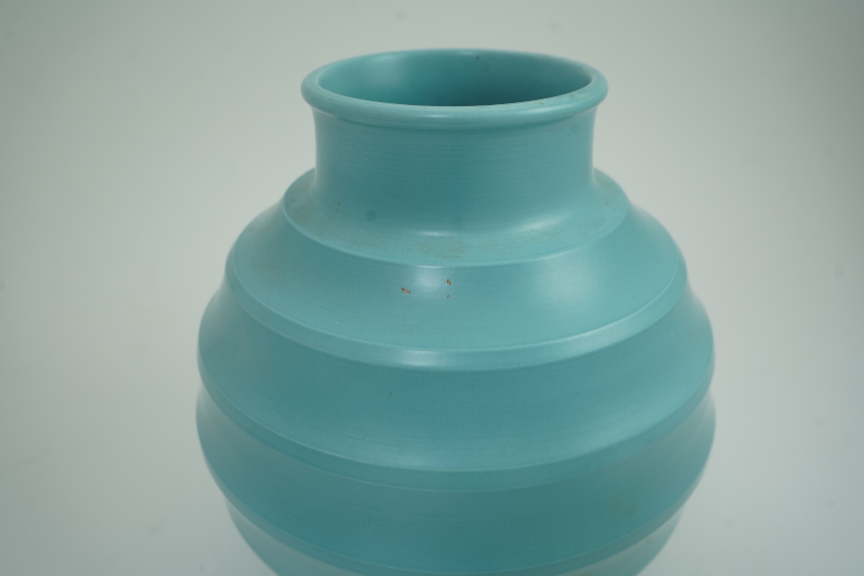 Keith Murray MC RDI FRIBA (New Zealand/British, 1892-1981) for Wedgwood: A matt blue glazed globe vase